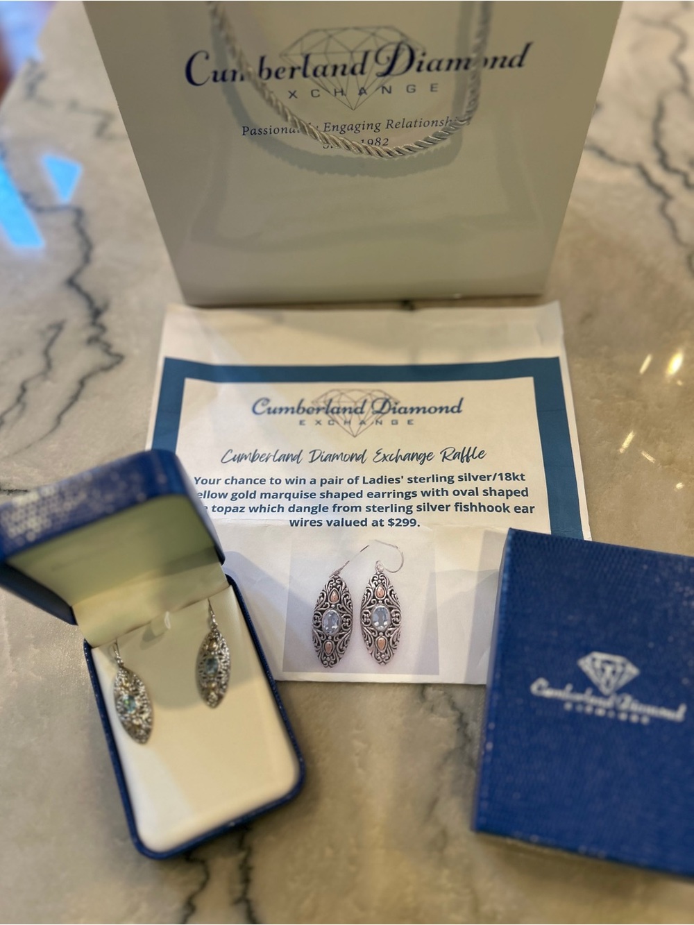 Sterling Silver/18kt gold Marquise Drop Earrings with oval blue topaz stone